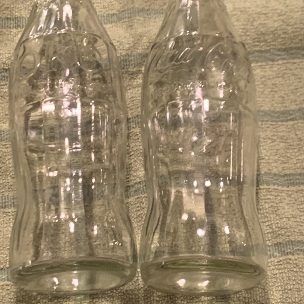 2 glass Coca-cola bottles clear circa 1980